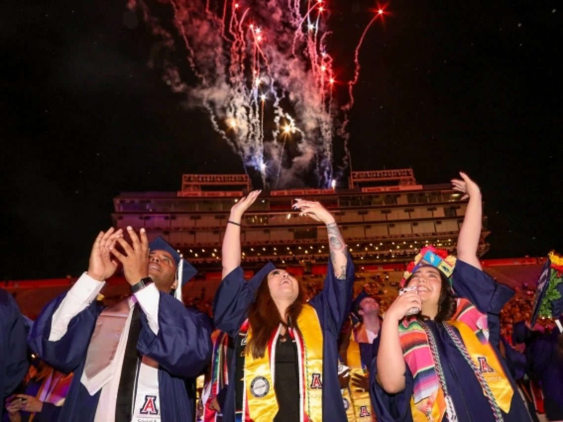 graduates at commencement